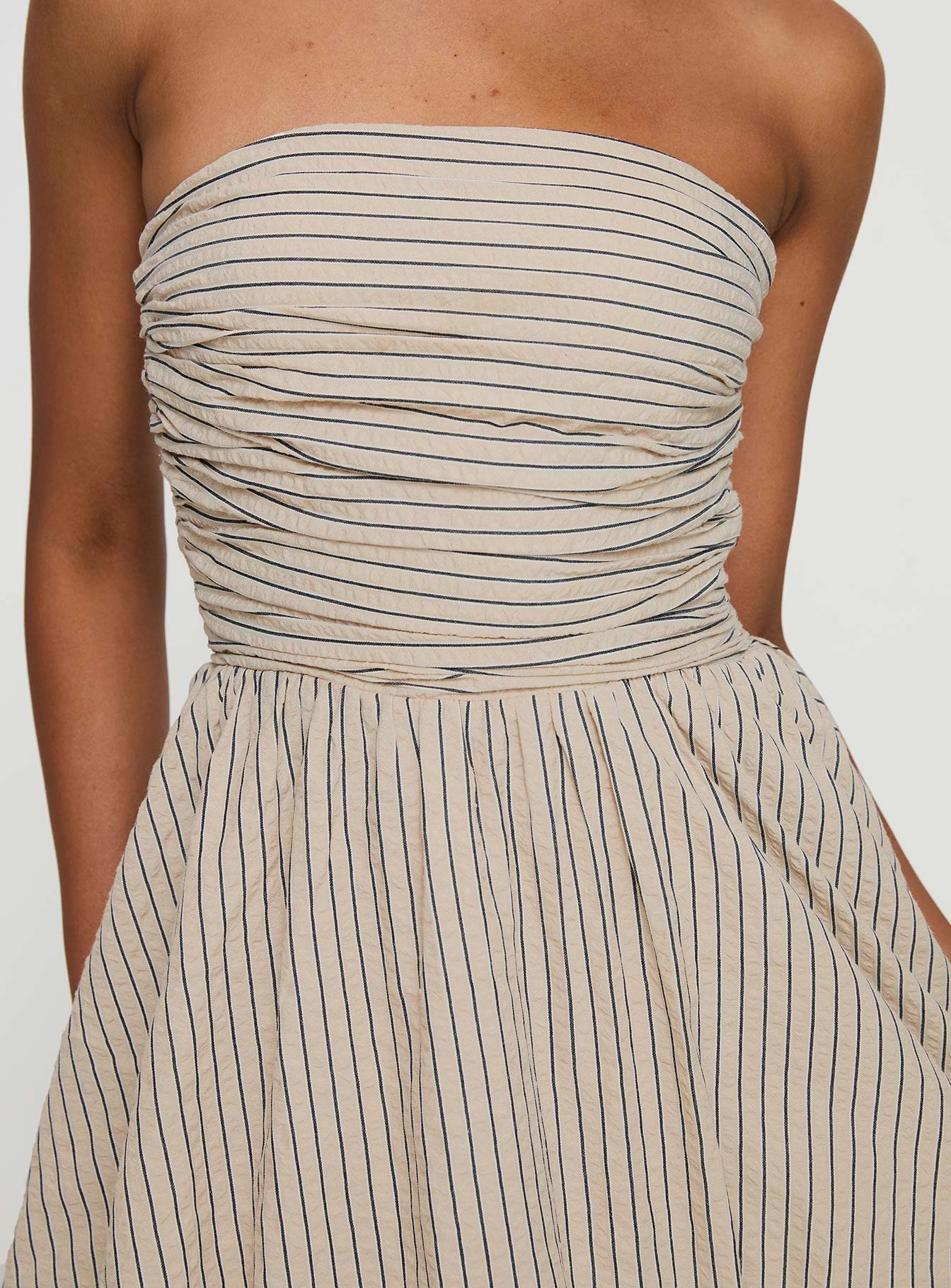 Quinette Strapless Bubble Hem Mini Dress Beige Stripe Feminine empire waist dress Sophisticated Layers